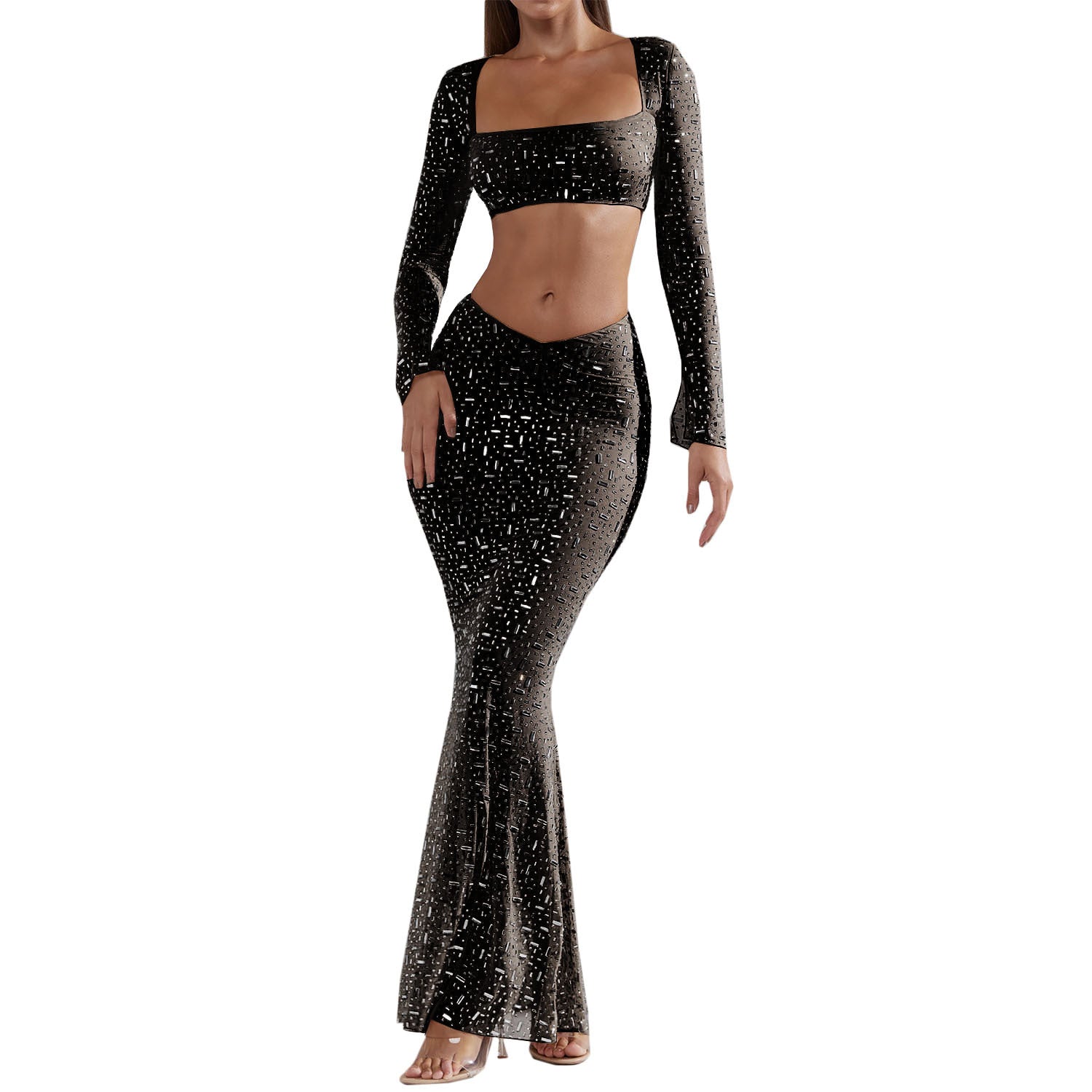 A stylish women's outfit featuring a sexy rhinestone crop top with long sleeves and a low-rise midi mermaid skirt, perfect for elegant occasions.