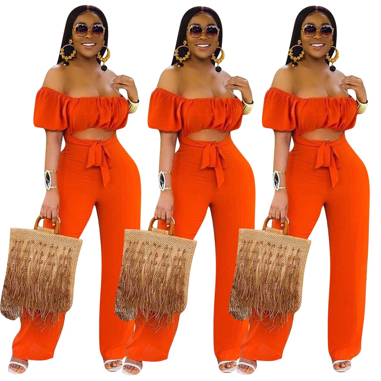 A stylish woman wearing a solid color backless off shoulder jumpsuit, showcasing its elegant design and comfortable fit.