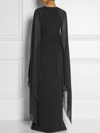 Elegant long black dress for women with translucent side panels and a side split, featuring a round collar and an invisible zipper at the back.