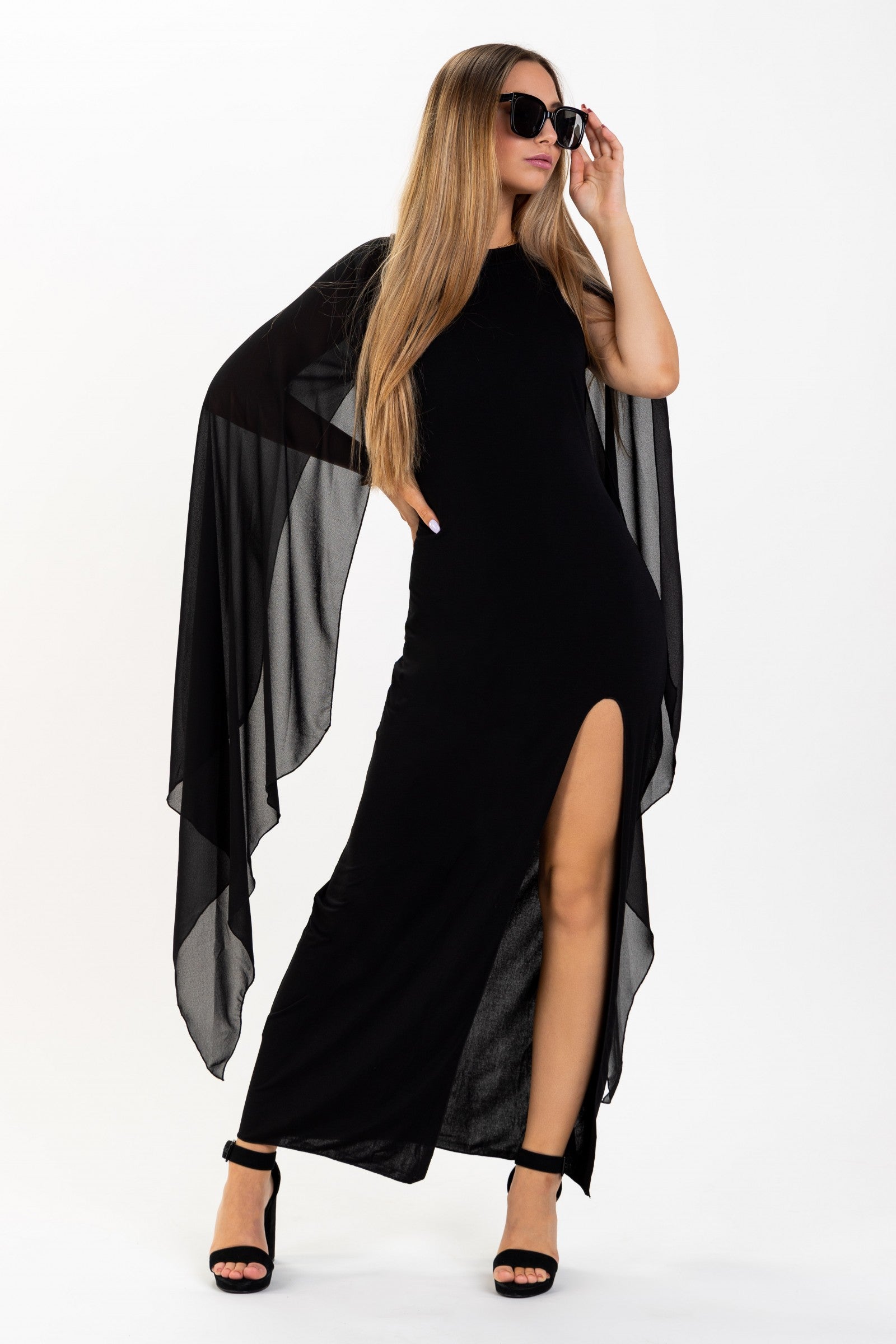 Elegant long black dress for women with translucent side panels and a side split, featuring a round collar and an invisible zipper at the back.