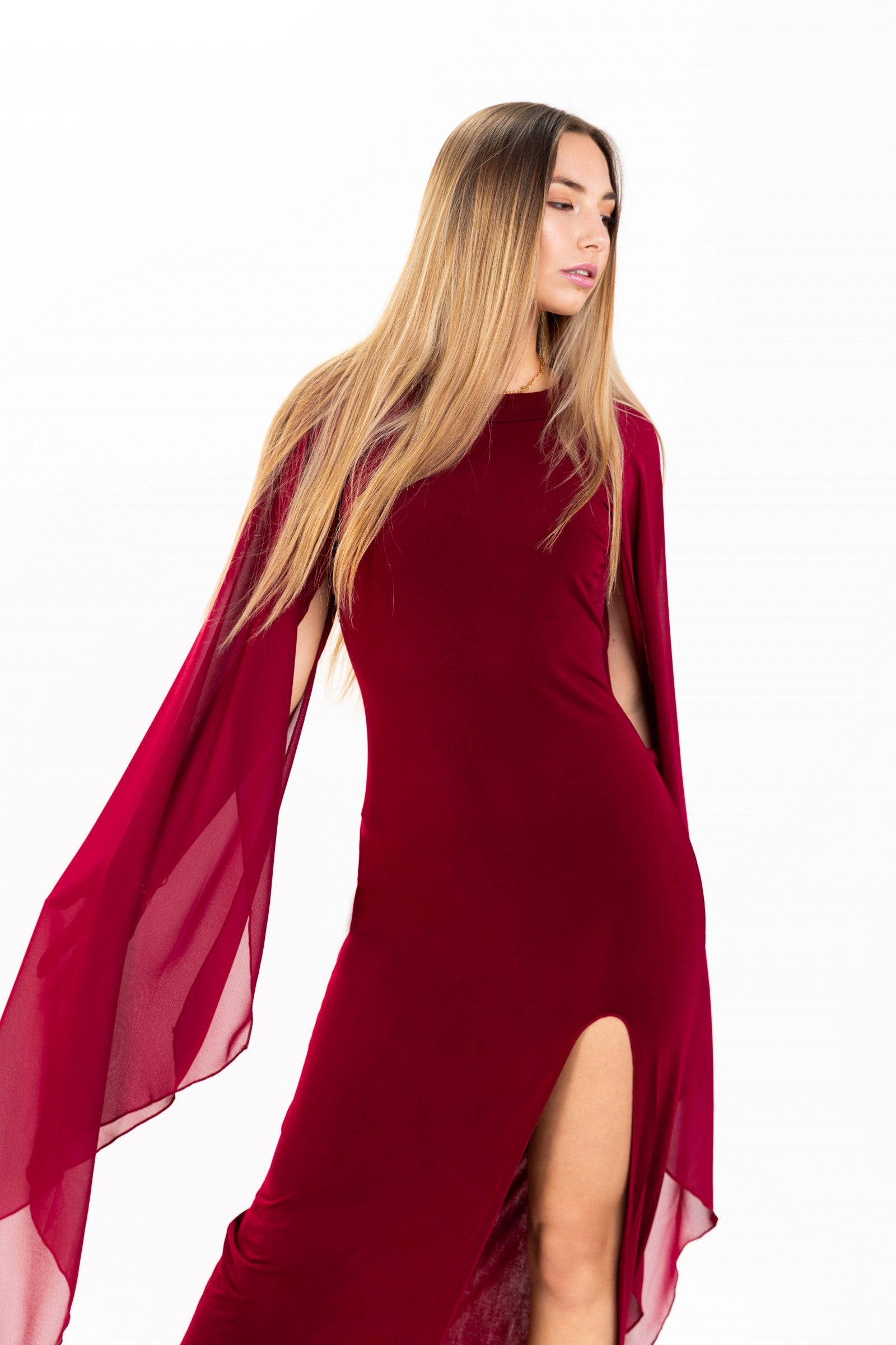 Elegant long bordo dress for women with translucent side panels and round collar, featuring an invisible zipper at the back.