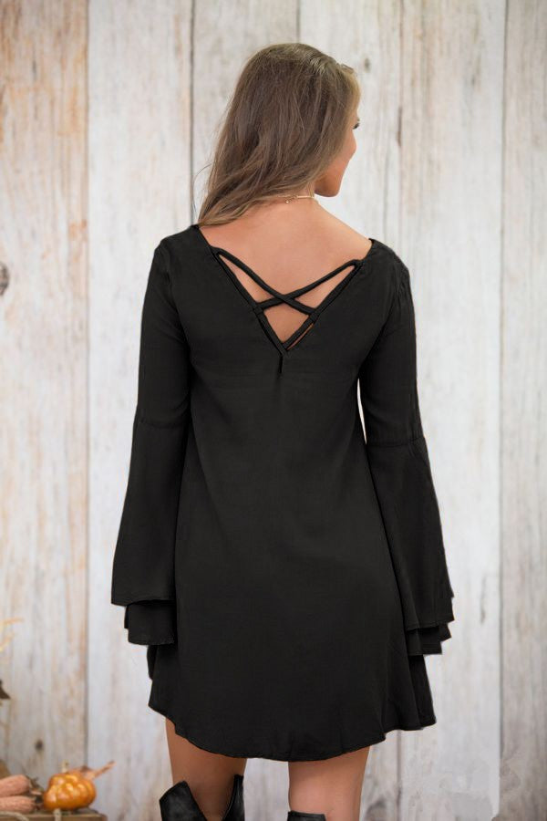 WOMEN DRESS RANIA in black featuring bell sleeves and unique back design, perfect for modern styling.