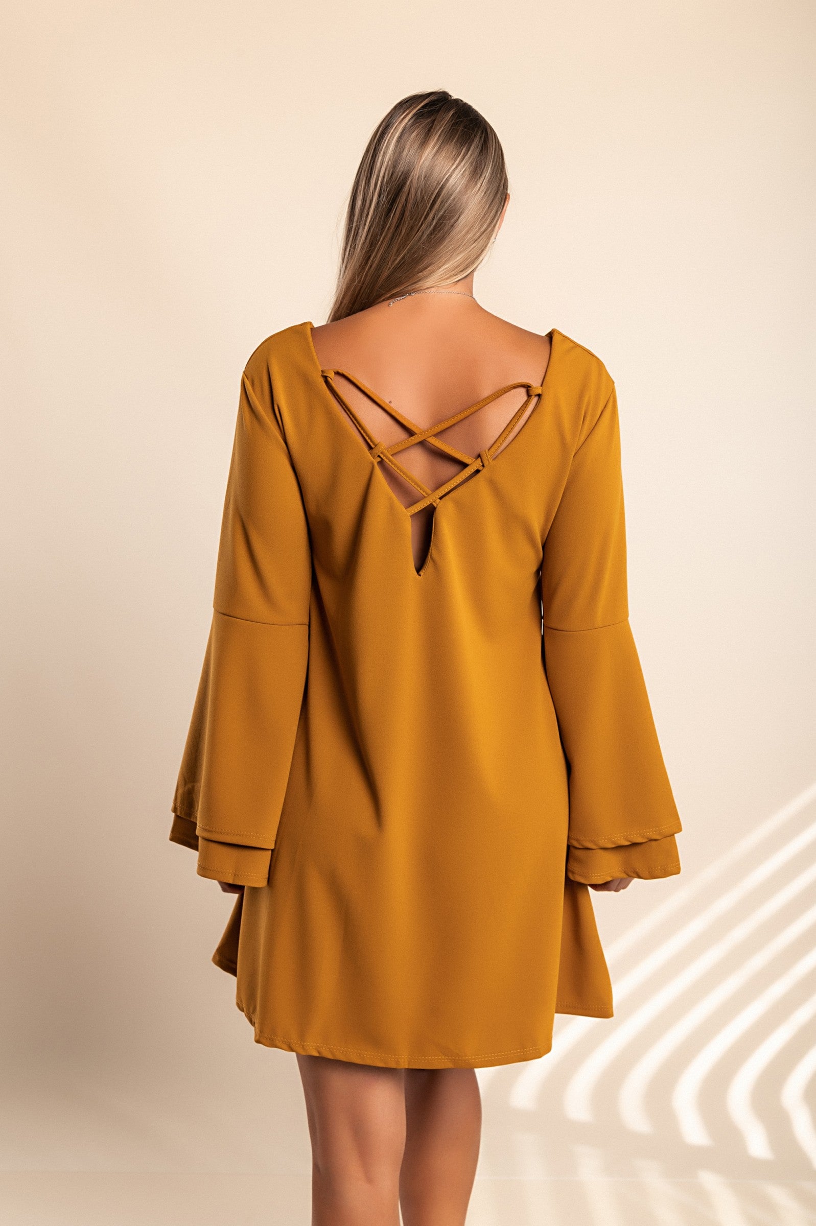 Stylish WOMEN DRESS RANIA in Mustard with bell sleeves and unique back design, perfect for modern looks.