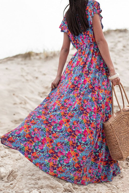 Women Floral Print V Neck Wrap Split Maxi Dress featuring a high waist, side slit, and short sleeves in a vibrant floral pattern.