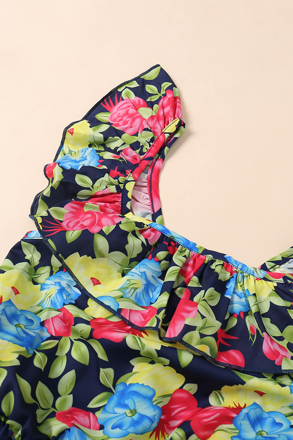 A stylish Women Floral Ruffled Dress featuring a vibrant floral pattern, square neckline, and butterfly sleeves, perfect for summer outings.