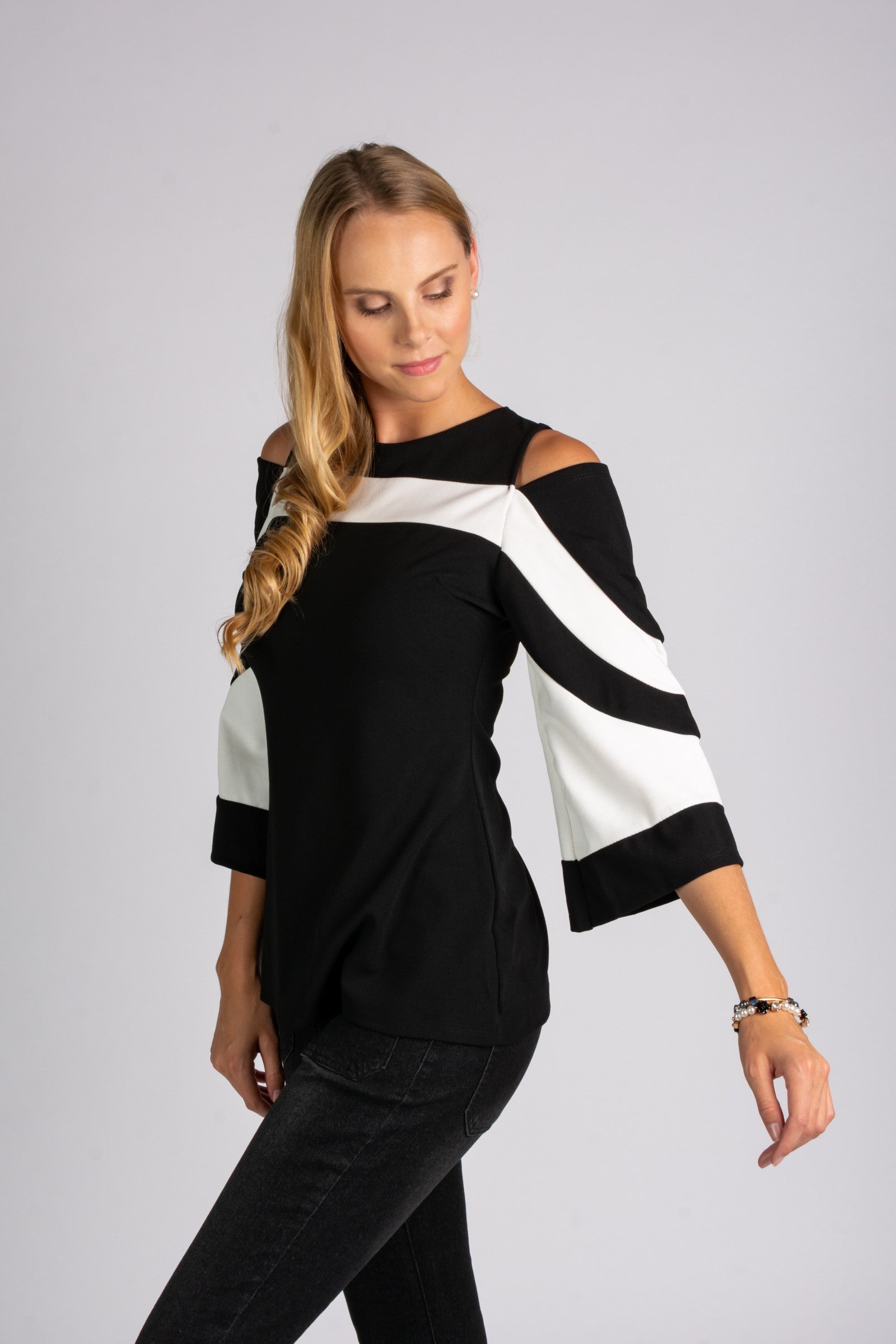 Elegant WOMEN SHIRT NINITA featuring a large collar, open shoulder, and stylish 3/4 bell sleeves in black and white.