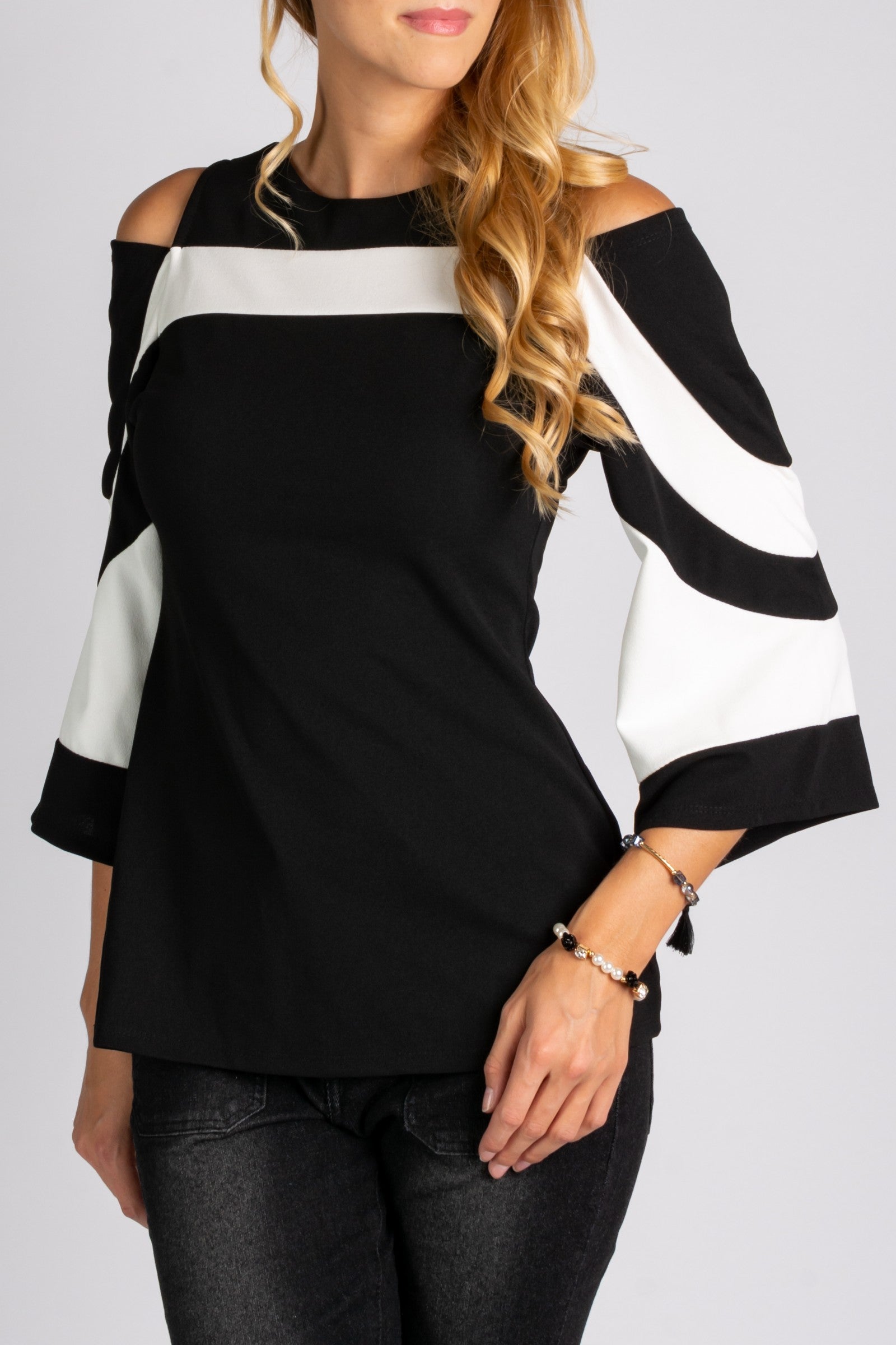 Elegant WOMEN SHIRT NINITA featuring a large collar, open shoulder, and 3/4 bell sleeves in black and white.