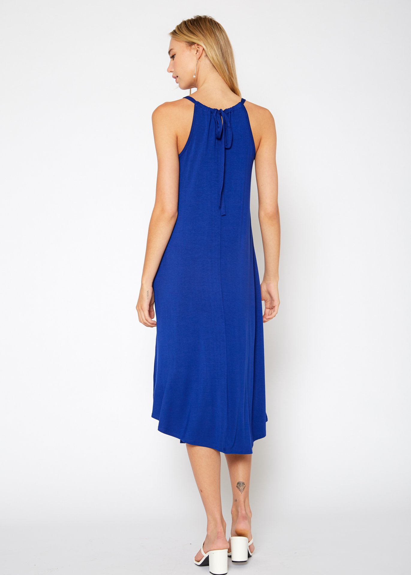 A stylish Women's Basic Haltered Dress featuring a halter neck design and rear neck tie, made from a soft rayon and spandex blend.