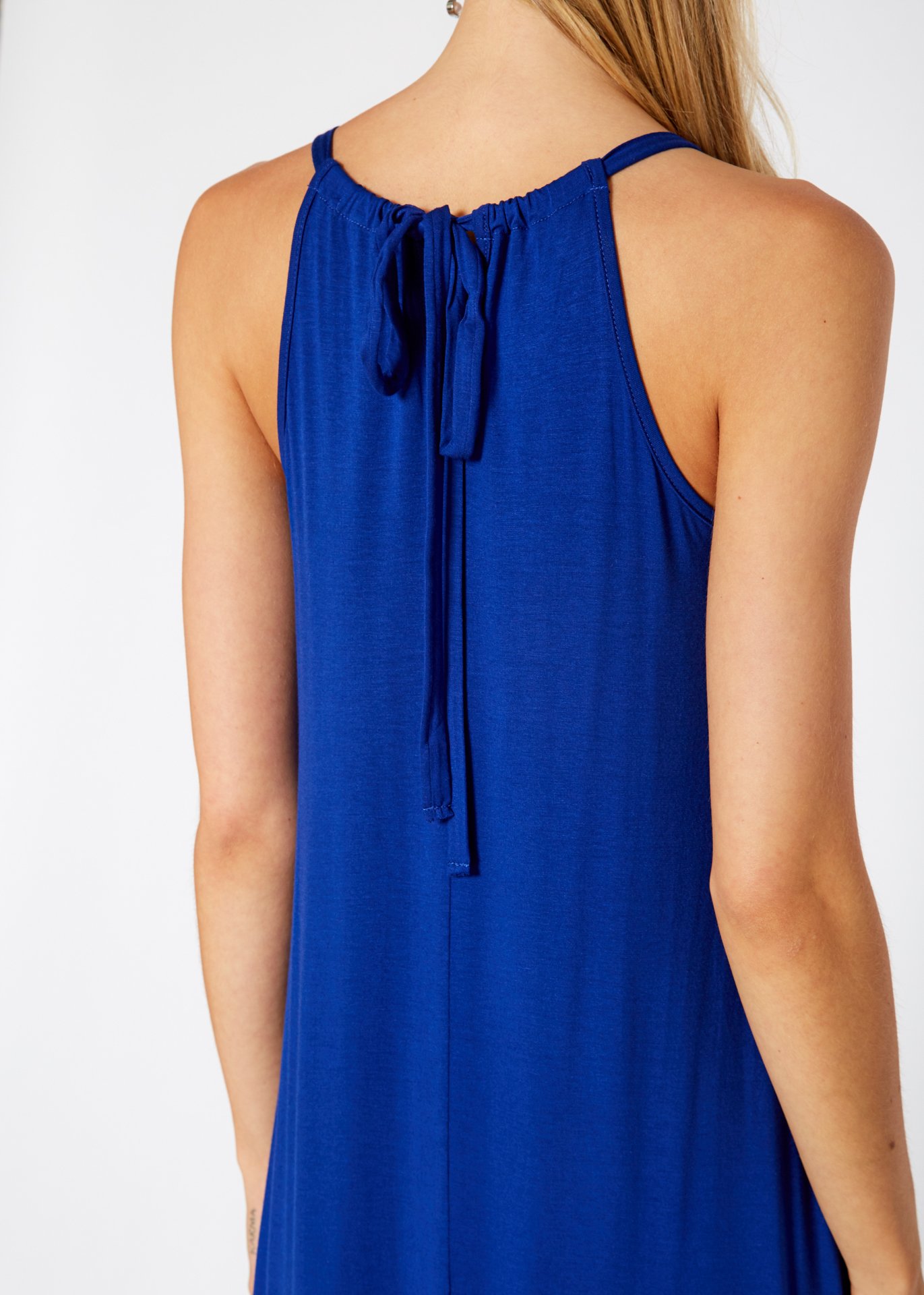 A stylish Women's Basic Haltered Dress featuring a halter neck design and rear neck tie, made from a soft rayon and spandex blend.