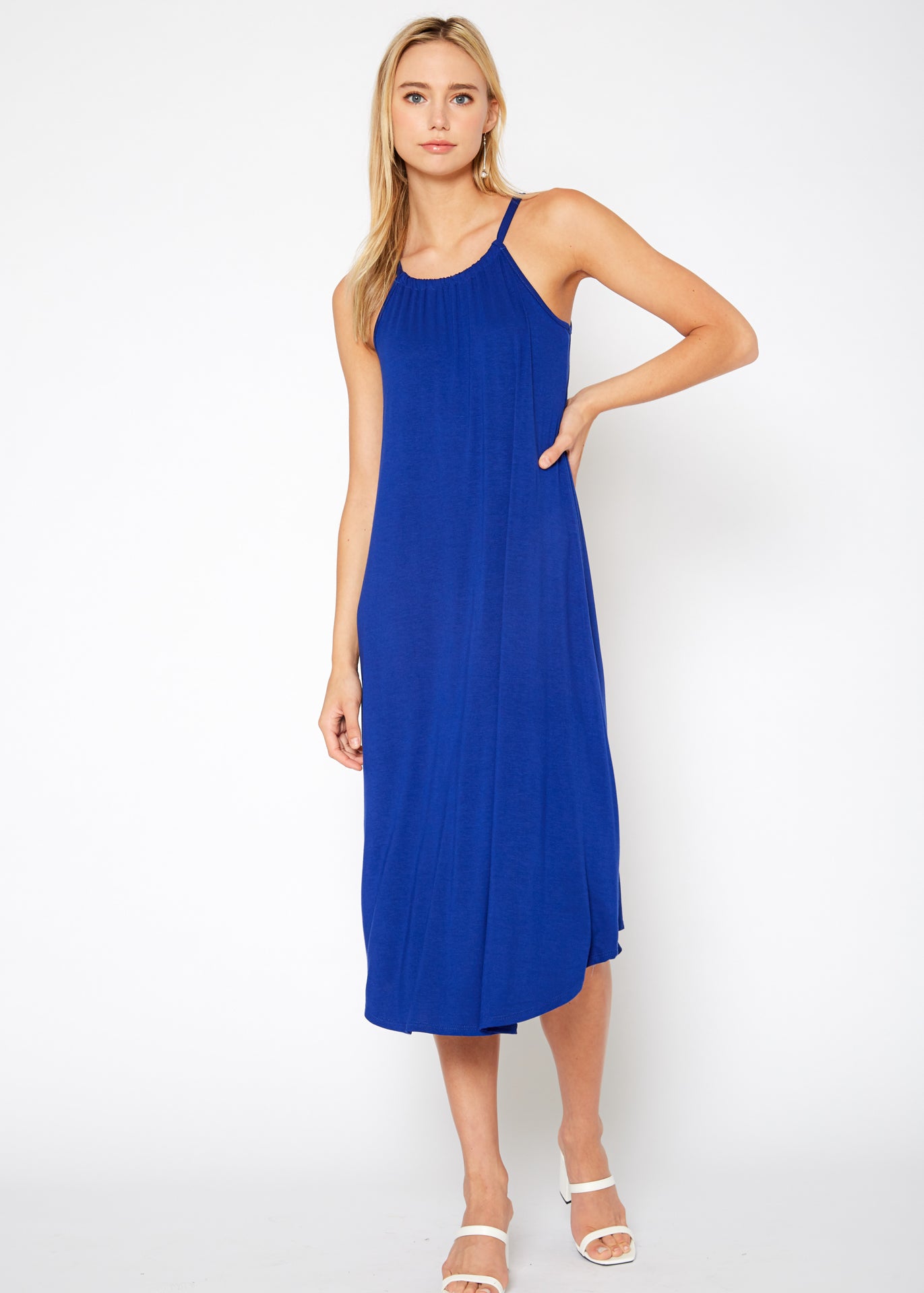 A stylish Women's Basic Haltered Dress featuring a halter neck design and rear neck tie, made from a soft rayon and spandex blend.