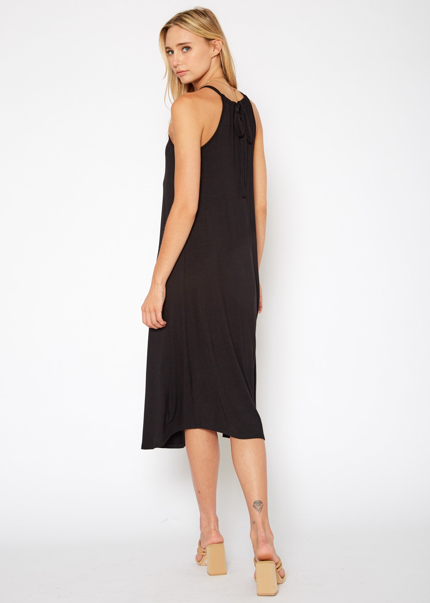 A stylish Women's Basic Haltered Dress featuring a halter neck design and rear neck tie, made from a soft rayon and spandex blend.