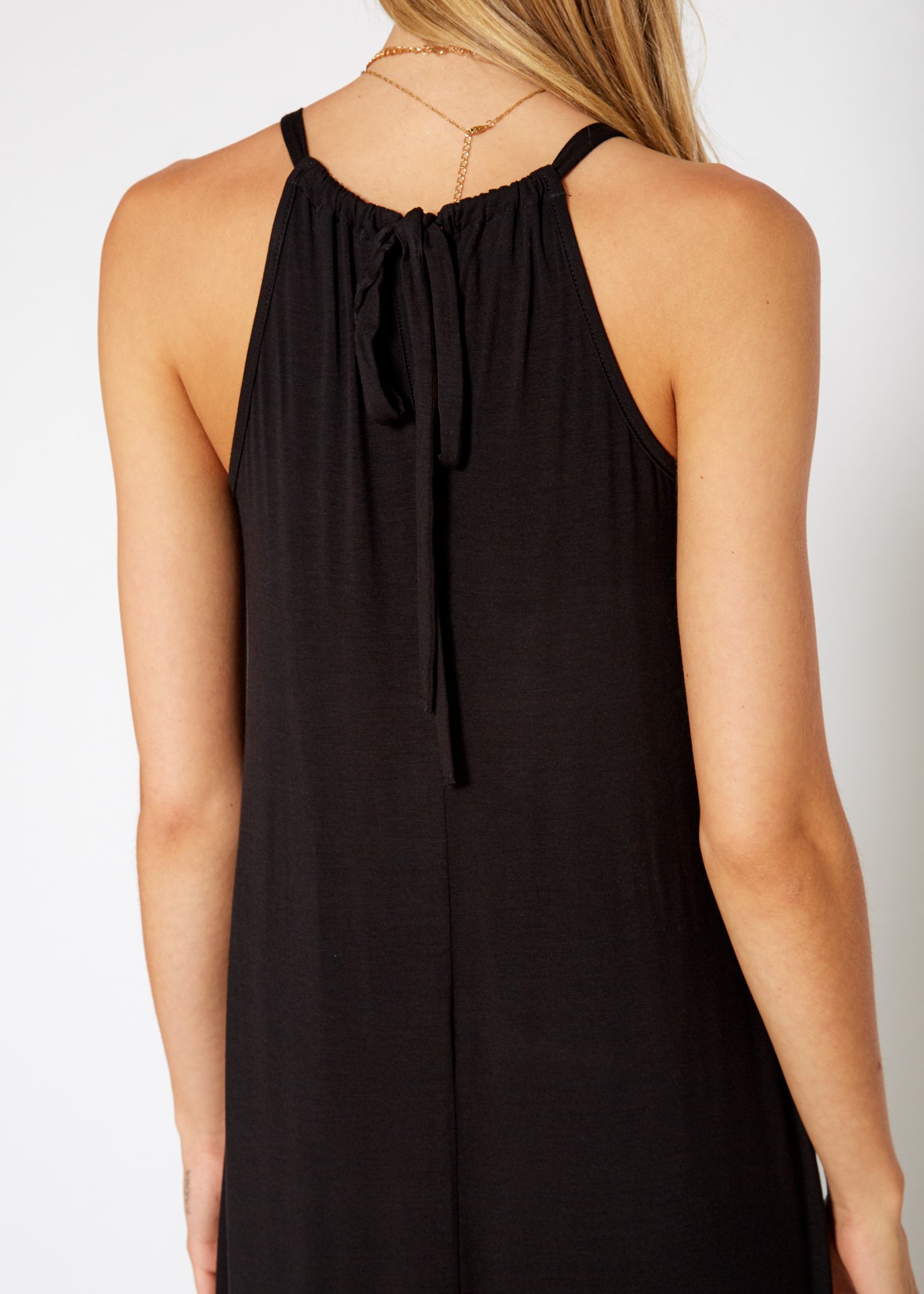 A stylish Women's Basic Haltered Dress featuring a halter neck design and rear neck tie, made from a soft rayon and spandex blend.