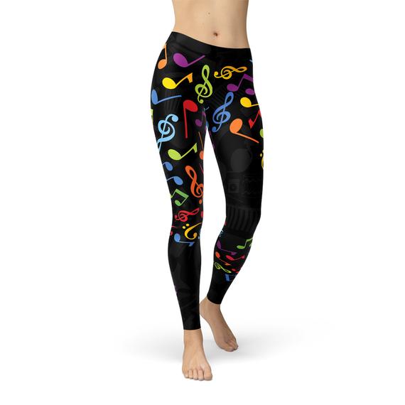 A pair of vibrant women's leggings featuring colorful music notes design, perfect for workouts and casual wear.