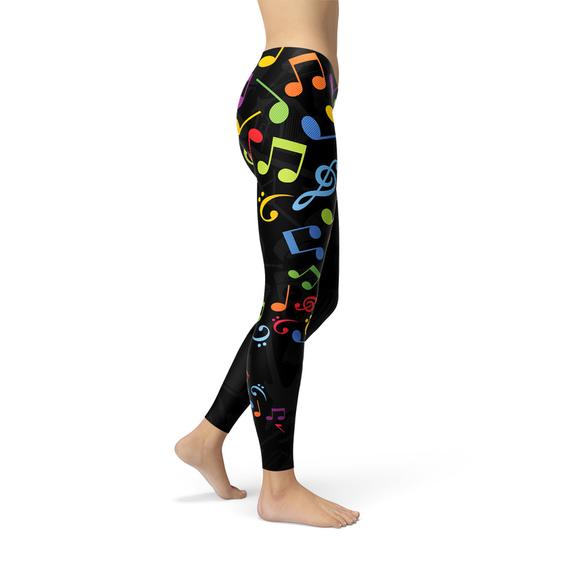 A pair of vibrant women's leggings featuring colorful music notes design, perfect for workouts and casual wear.