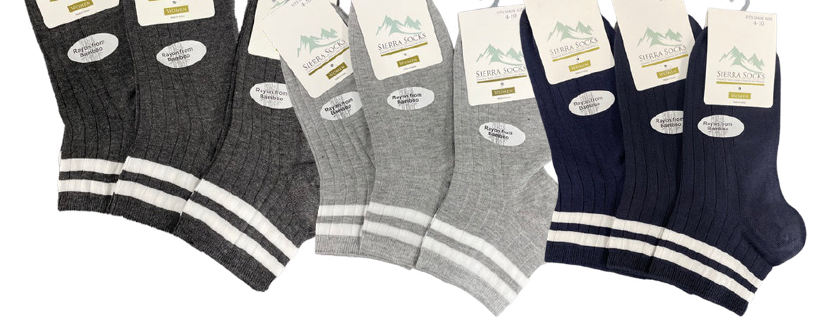 A pack of Women's Diabetic Arthritic Rayon and Bamboo Crew Socks in assorted colors, showcasing their soft texture and non-binding top design.