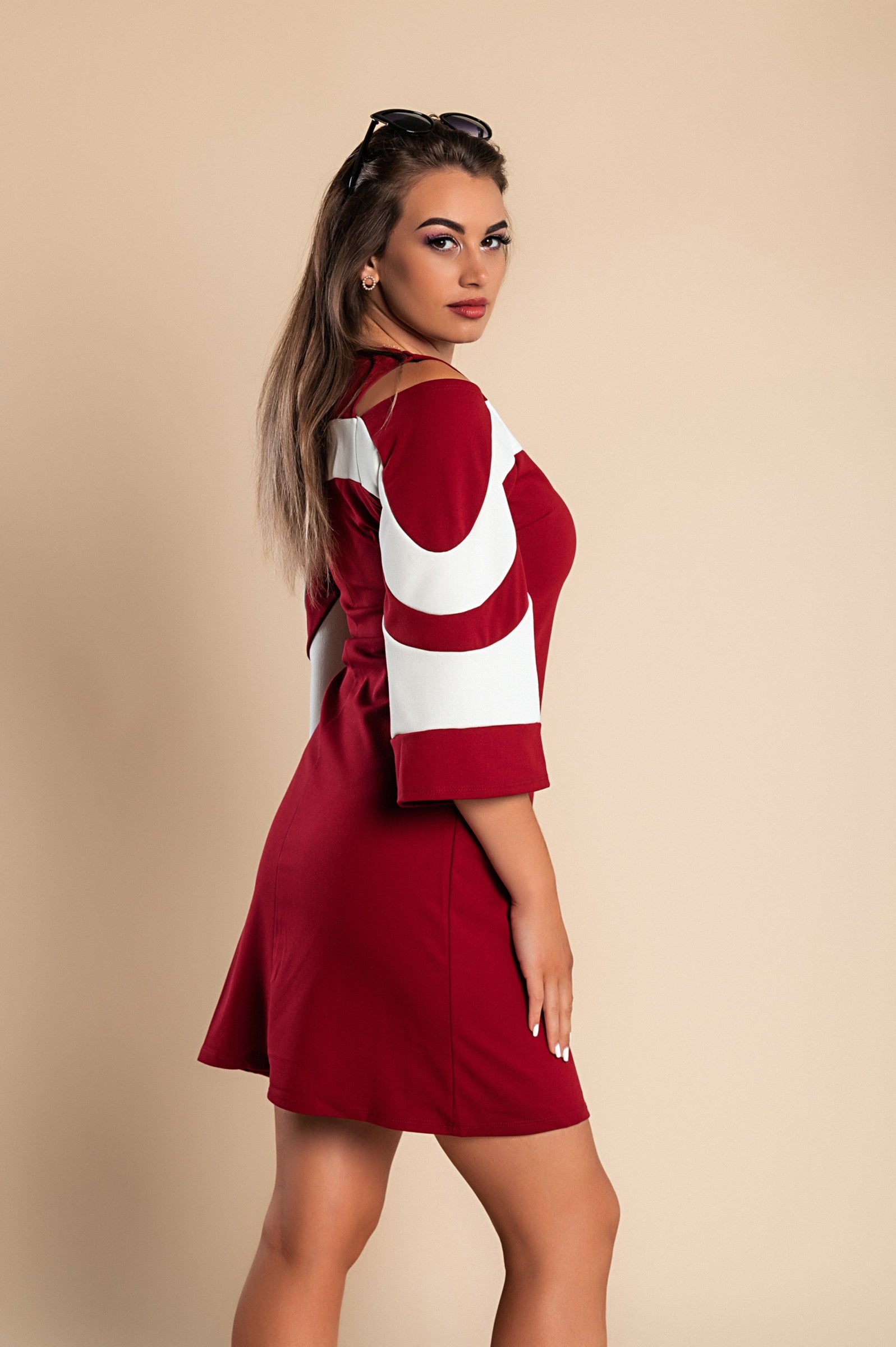 Elegant women's dress in Bordo with 3/4 bell sleeves and mid-thigh length, featuring a back zipper.