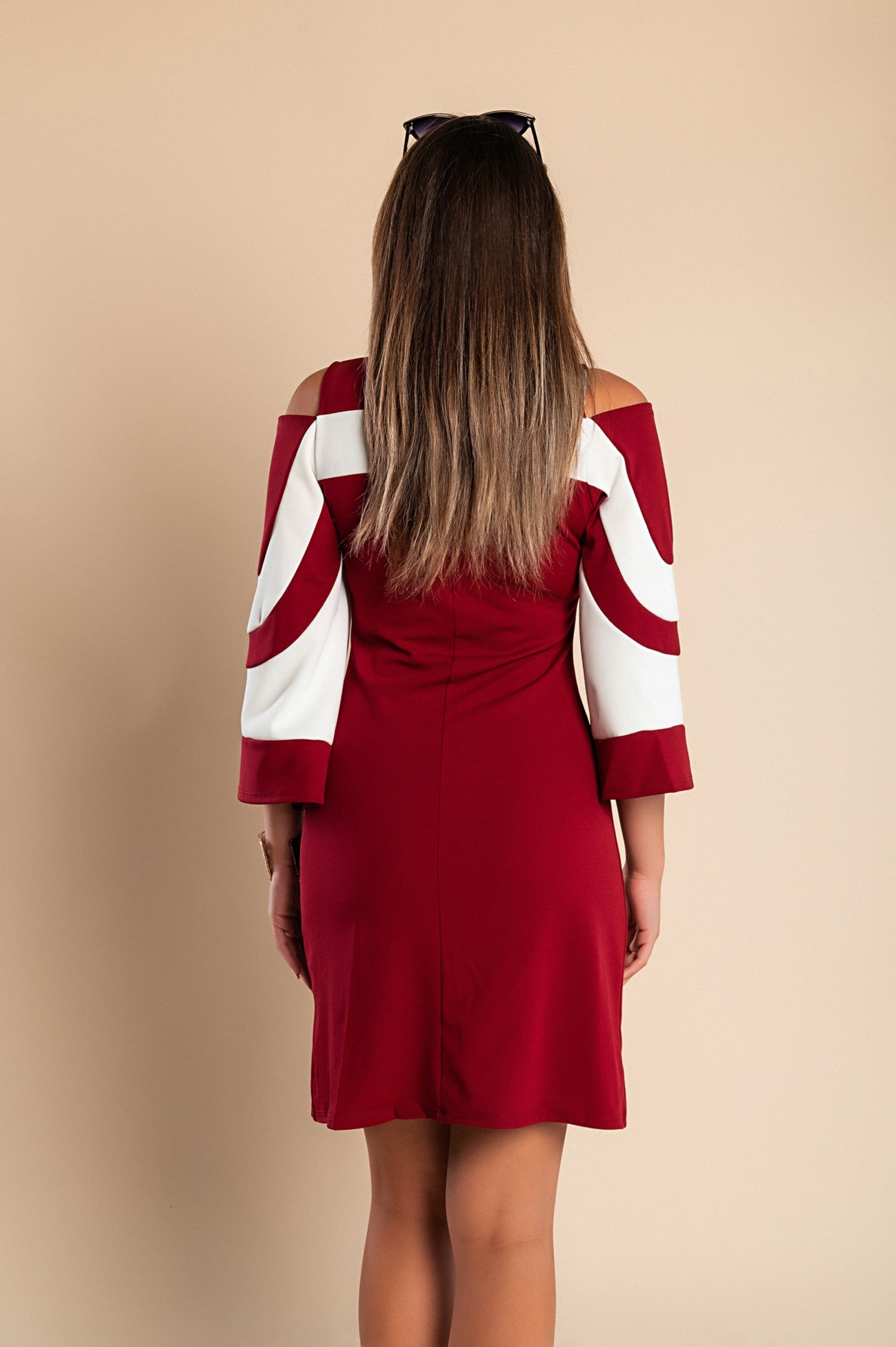 Elegant women's dress in Bordo with 3/4 bell sleeves and mid-thigh length, featuring a back zipper.