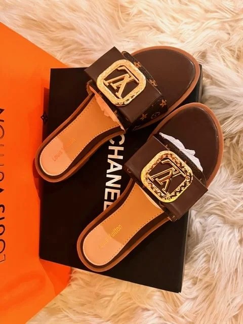 A pair of stylish Women's Fashion Flat Slide Sandals with LV design, perfect for casual wear and travel.