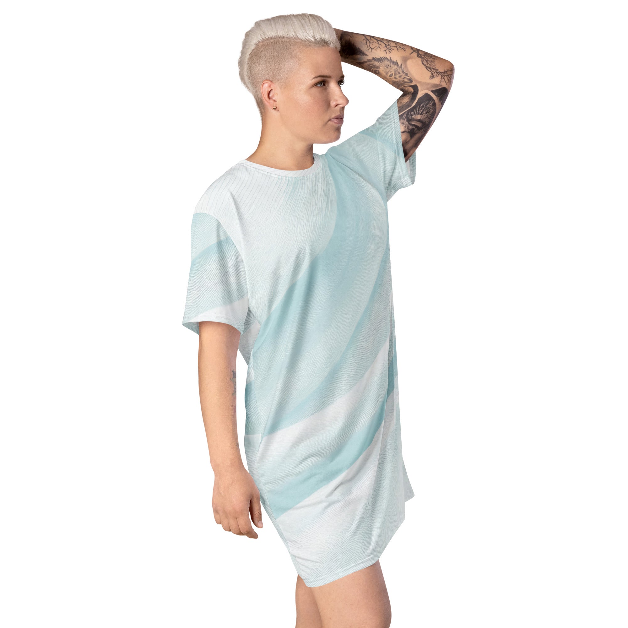 Womens Graphic T-shirt Dress featuring a pastel blue swirl pattern, showcasing its oversized fit and stylish design.