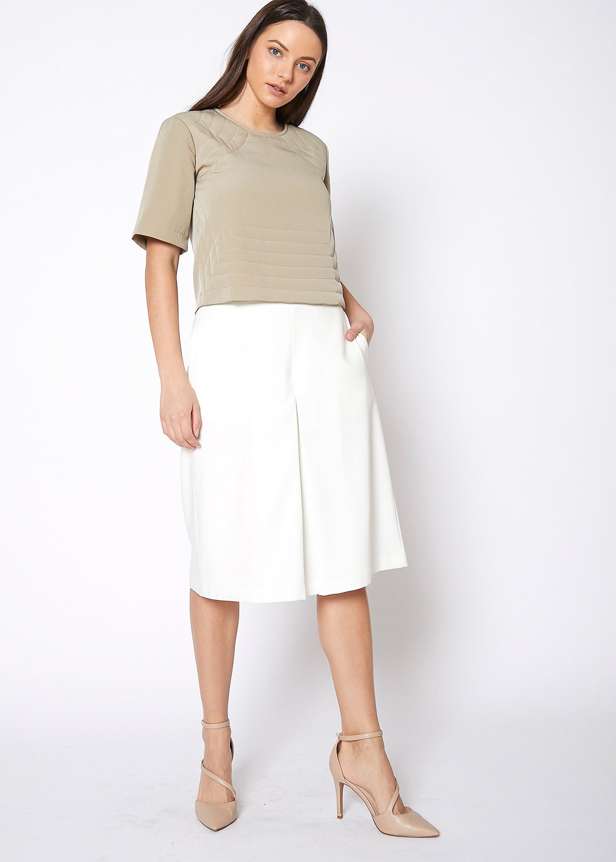 Women's High Rise Overlay Culottes featuring a skirt impression overlay and side pockets, made from high stretch twill fabric.