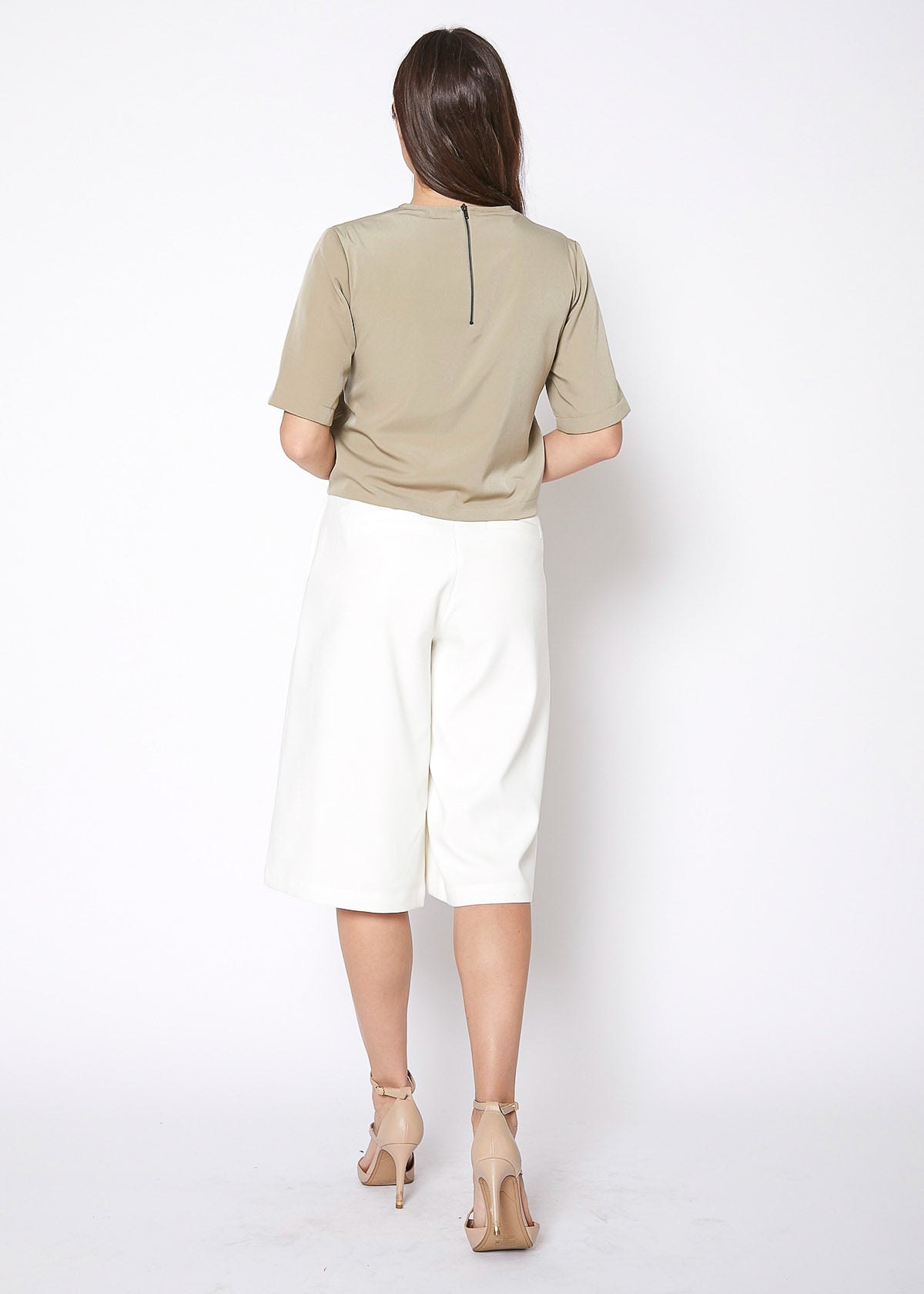 Women's High Rise Overlay Culottes featuring a skirt impression overlay and side pockets, made from high stretch twill fabric.