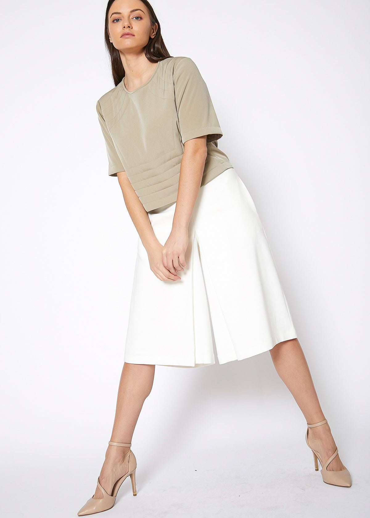 Women's High Rise Overlay Culottes featuring a skirt impression overlay and side pockets, made from high stretch twill fabric.