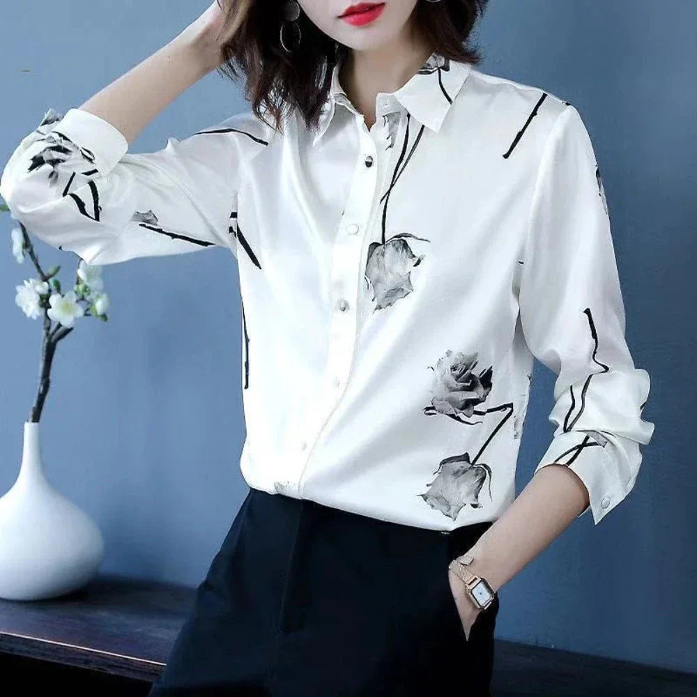 Women's Korean Theme Floral Shirt featuring a delicate floral pattern, classic collar, and button-down front, available in white and black.