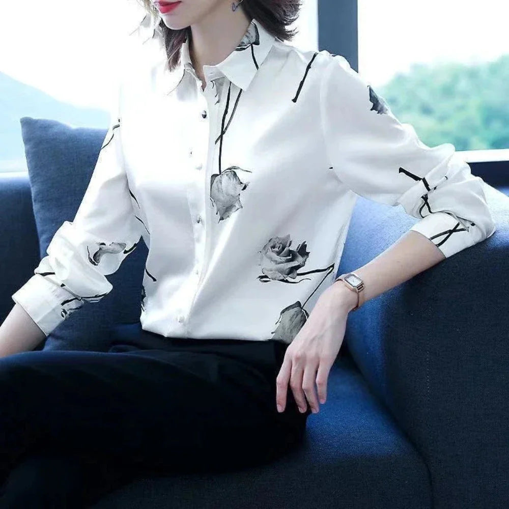 Women's Korean Theme Floral Shirt featuring a delicate floral pattern, classic collar, and button-down front, available in white and black.