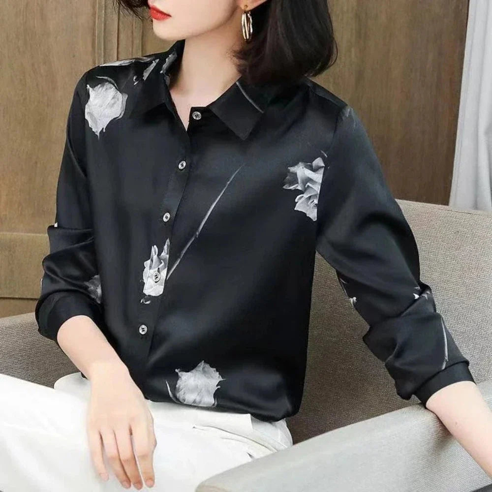 Women's Korean Theme Floral Shirt featuring a delicate floral pattern, classic collar, and button-down front, available in white and black.