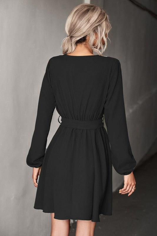 A stylish Women's Long Sleeve V Neck Mid Dress featuring elegant trim, made from a comfortable polyester and spandex blend.