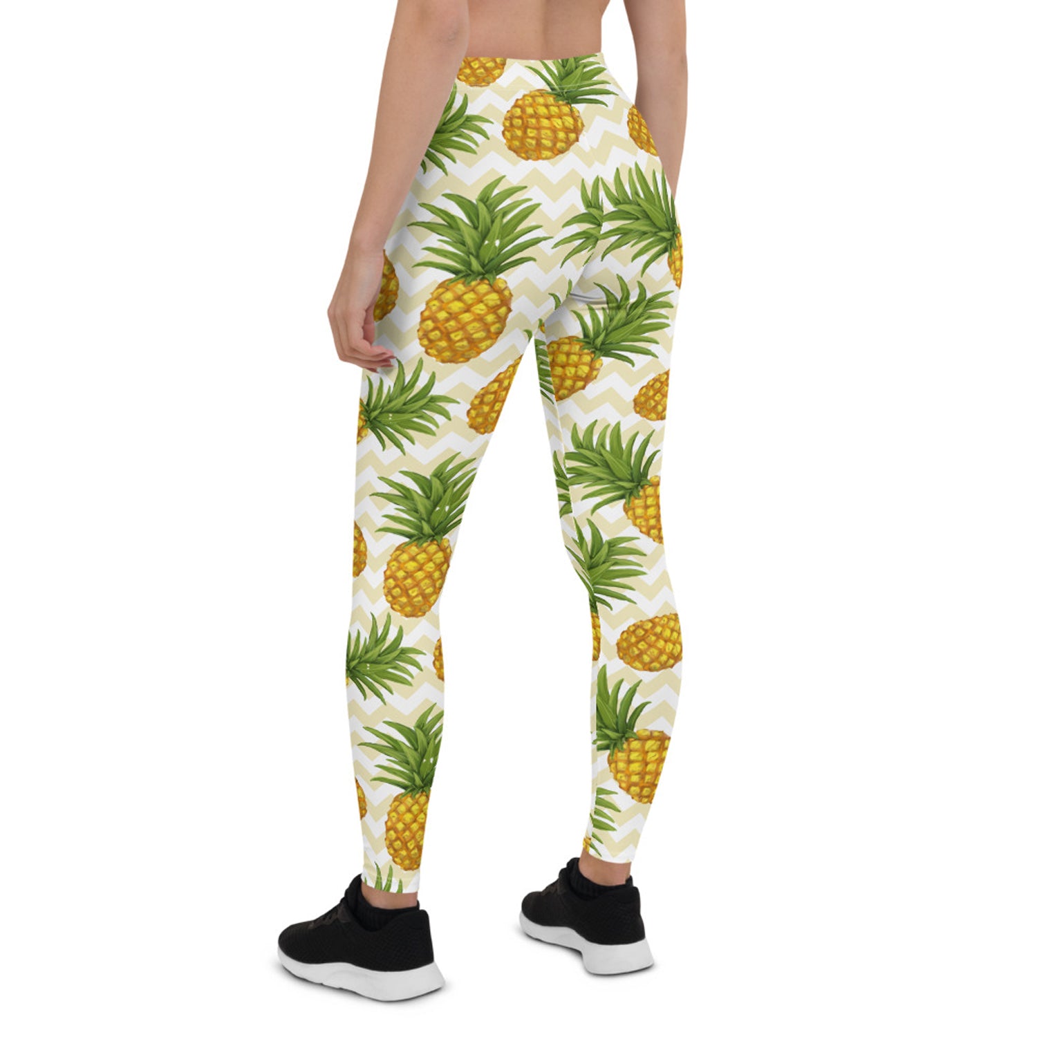 A pair of vibrant women's pineapple leggings featuring a unique graphic design, perfect for workouts and casual wear.