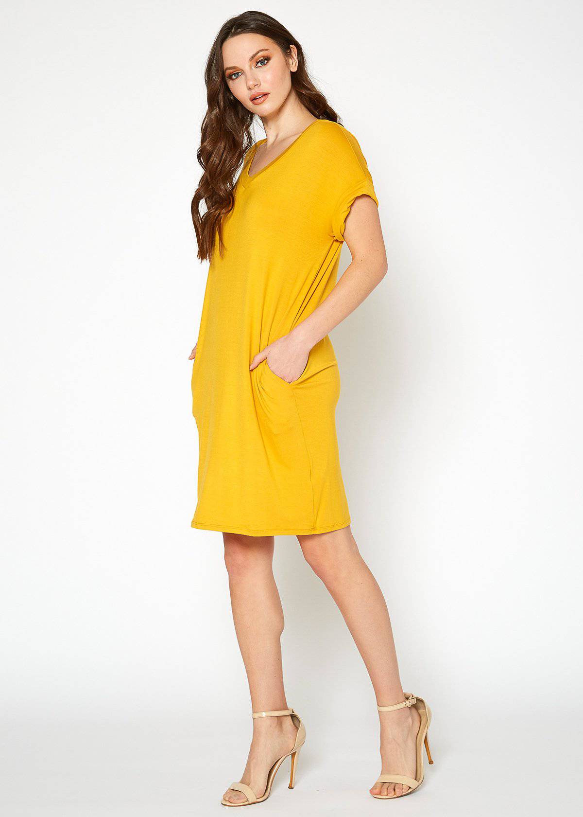 A stylish Women's Round Neck T-shirt Dress in a soft fabric, featuring a round neckline and convenient side pockets, perfect for casual wear.