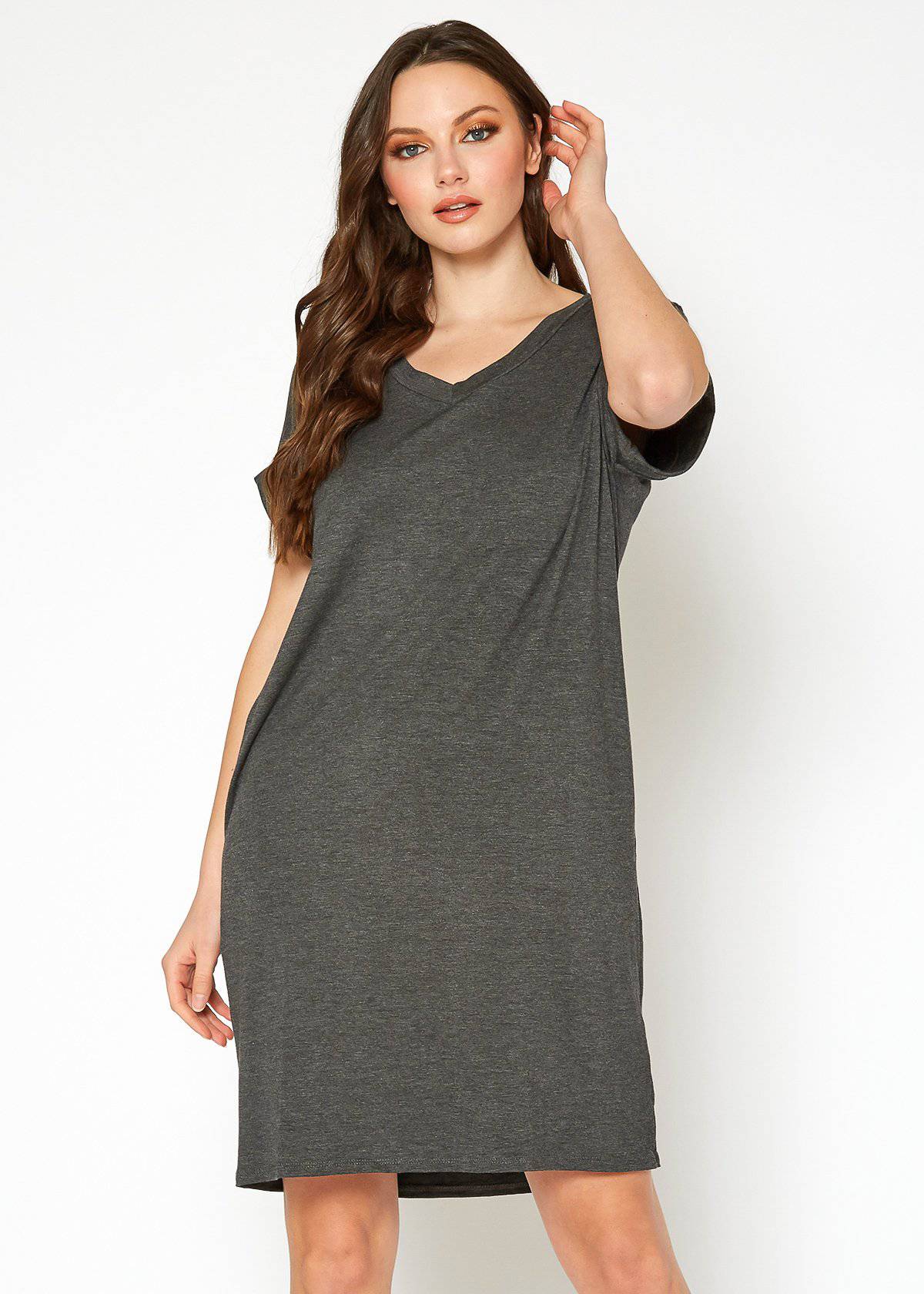 A stylish Women's Round Neck T-shirt Dress in a soft fabric, featuring a round neckline and convenient side pockets, perfect for casual wear.