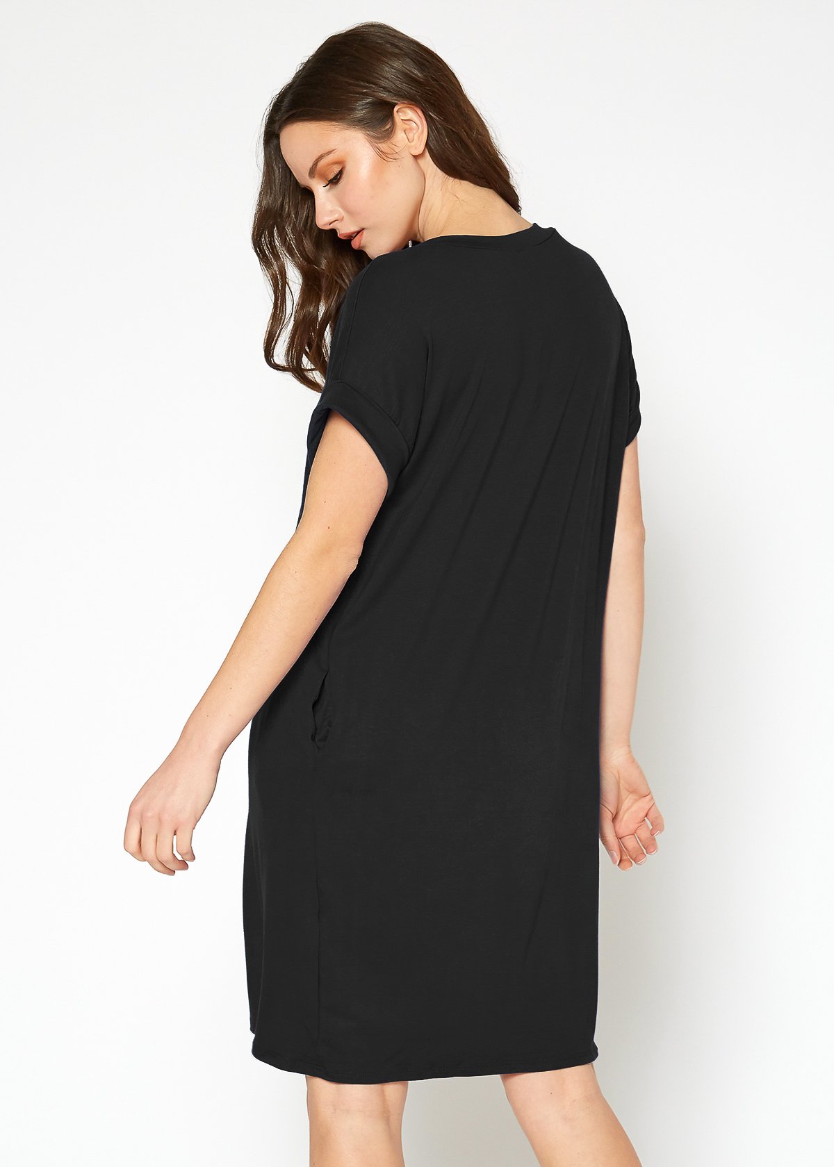 A stylish Women's Round Neck T-shirt Dress in a soft fabric, featuring a round neckline and convenient side pockets, perfect for casual wear.