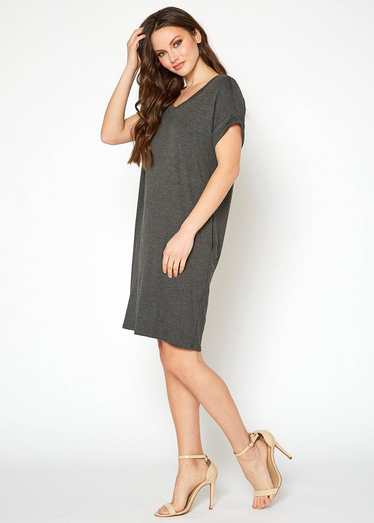 A stylish Women's Round Neck T-shirt Dress in a soft fabric, featuring a round neckline and convenient side pockets, perfect for casual wear.