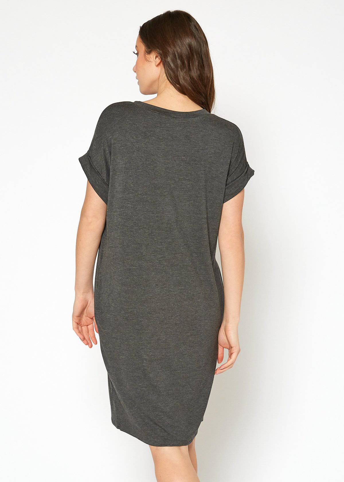 A stylish Women's Round Neck T-shirt Dress in a soft fabric, featuring a round neckline and convenient side pockets, perfect for casual wear.