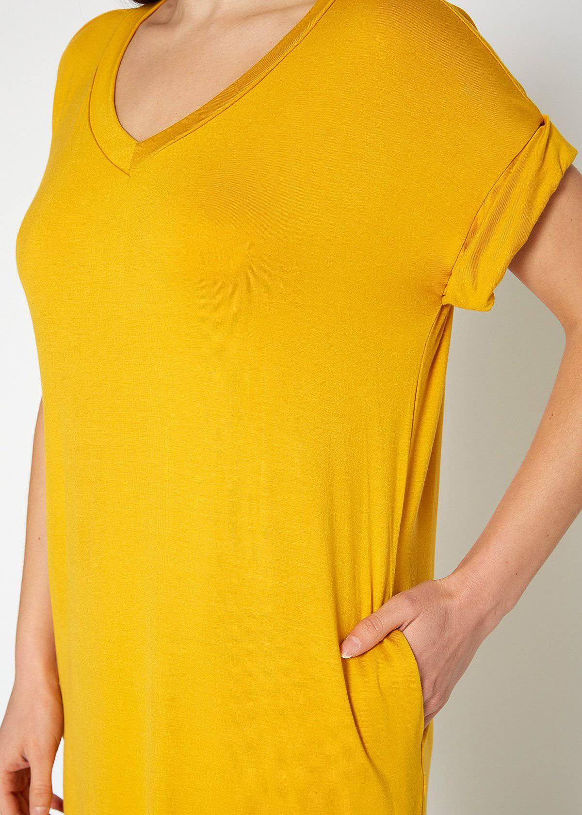 A stylish Women's Round Neck T-shirt Dress in a soft fabric, featuring a round neckline and convenient side pockets, perfect for casual wear.