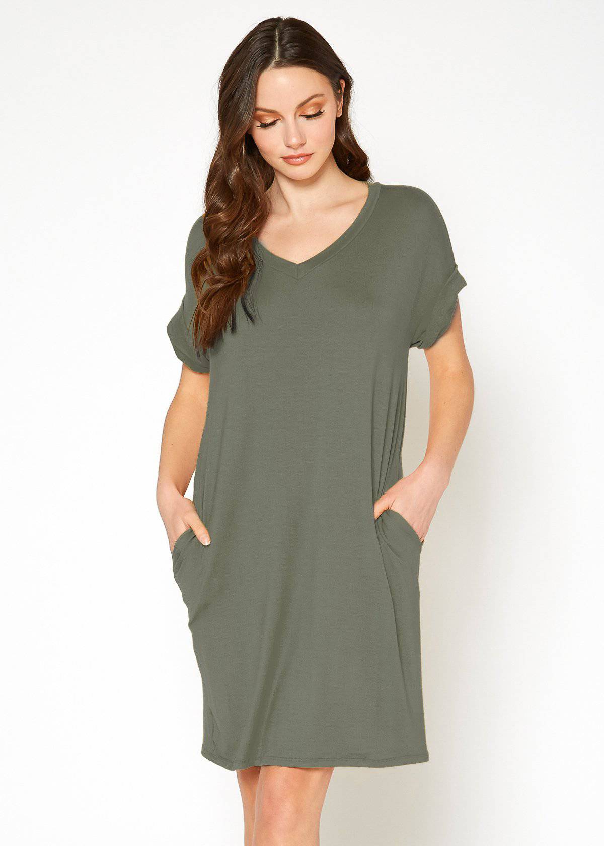 A stylish Women's Round Neck T-shirt Dress in a soft fabric, featuring a round neckline and convenient side pockets, perfect for casual wear.