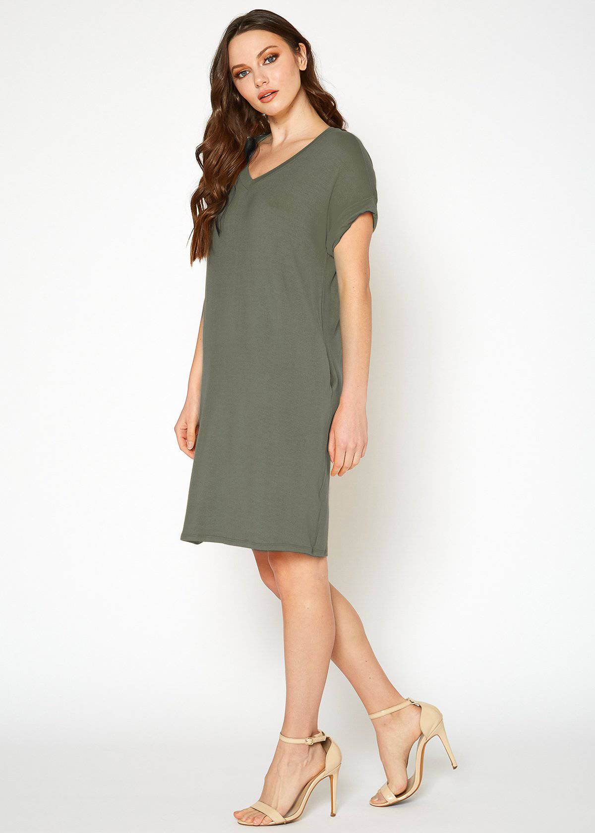 A stylish Women's Round Neck T-shirt Dress in a soft fabric, featuring a round neckline and convenient side pockets, perfect for casual wear.