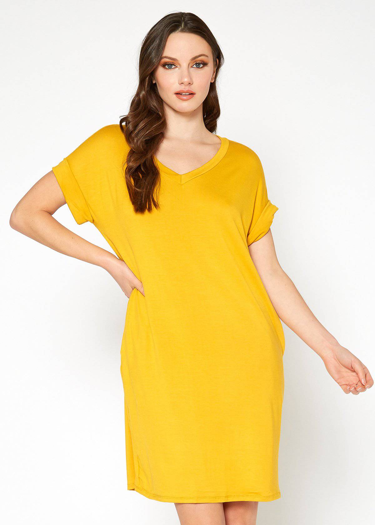 A stylish Women's Round Neck T-shirt Dress in a soft fabric, featuring a round neckline and convenient side pockets, perfect for casual wear.