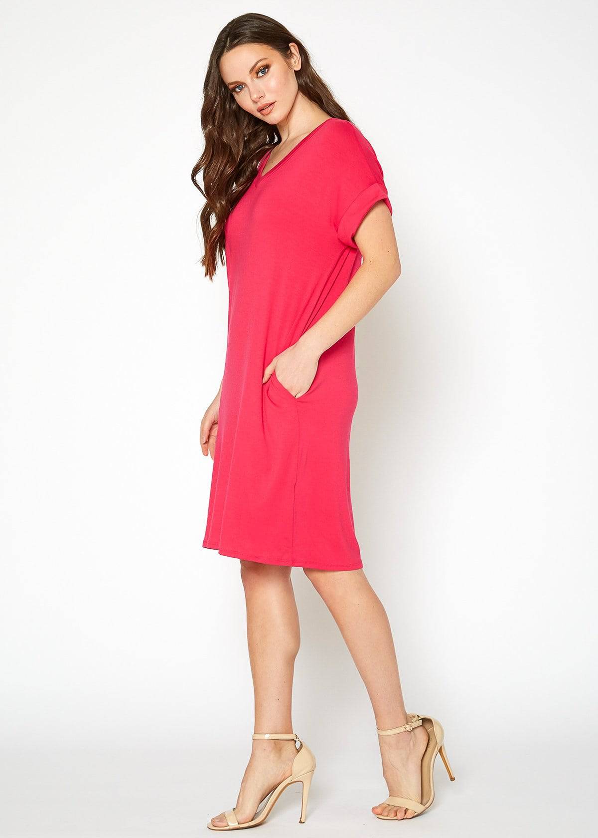 A stylish Women's Round Neck T-shirt Dress in a soft fabric, featuring a round neckline and convenient side pockets, perfect for casual wear.