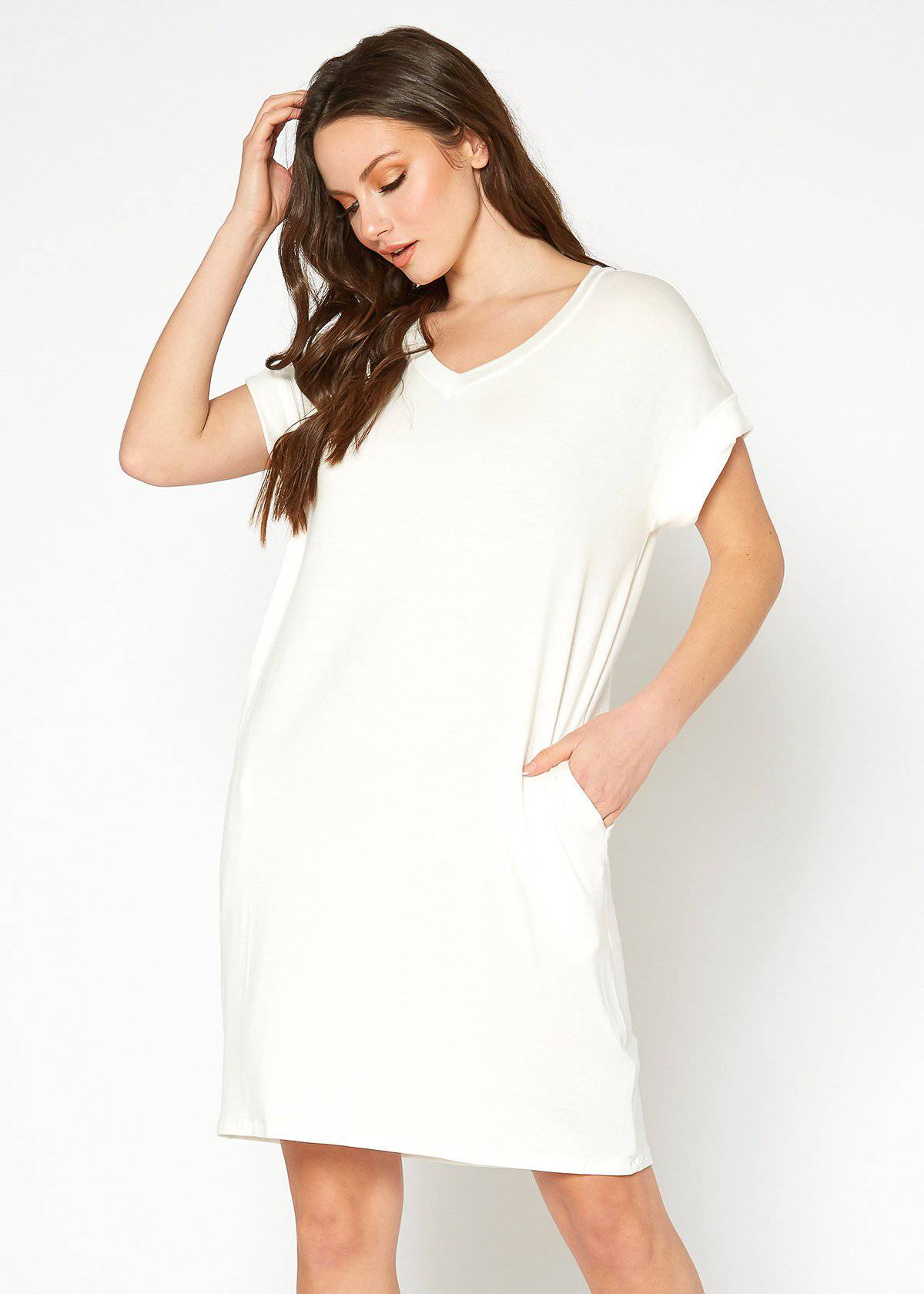 A stylish Women's Round Neck T-shirt Dress in a soft fabric, featuring a round neckline and convenient side pockets, perfect for casual wear.