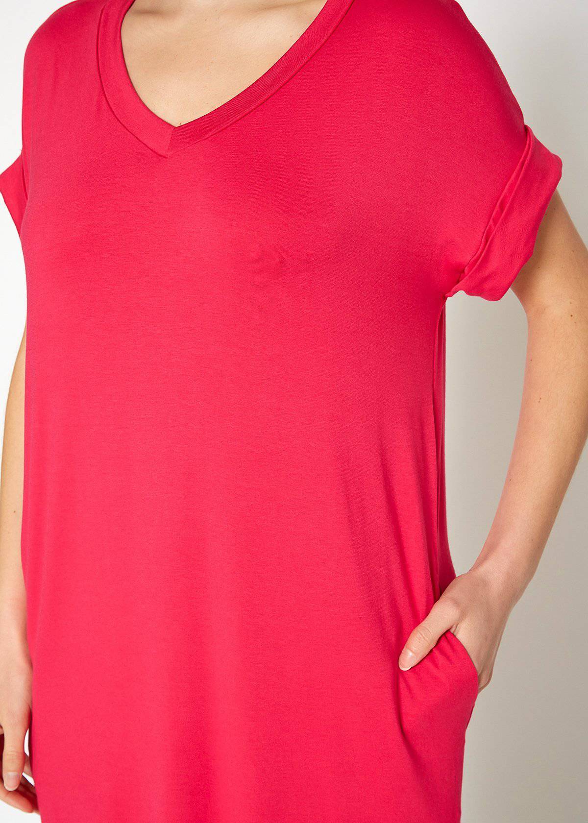 A stylish Women's Round Neck T-shirt Dress in a soft fabric, featuring a round neckline and convenient side pockets, perfect for casual wear.