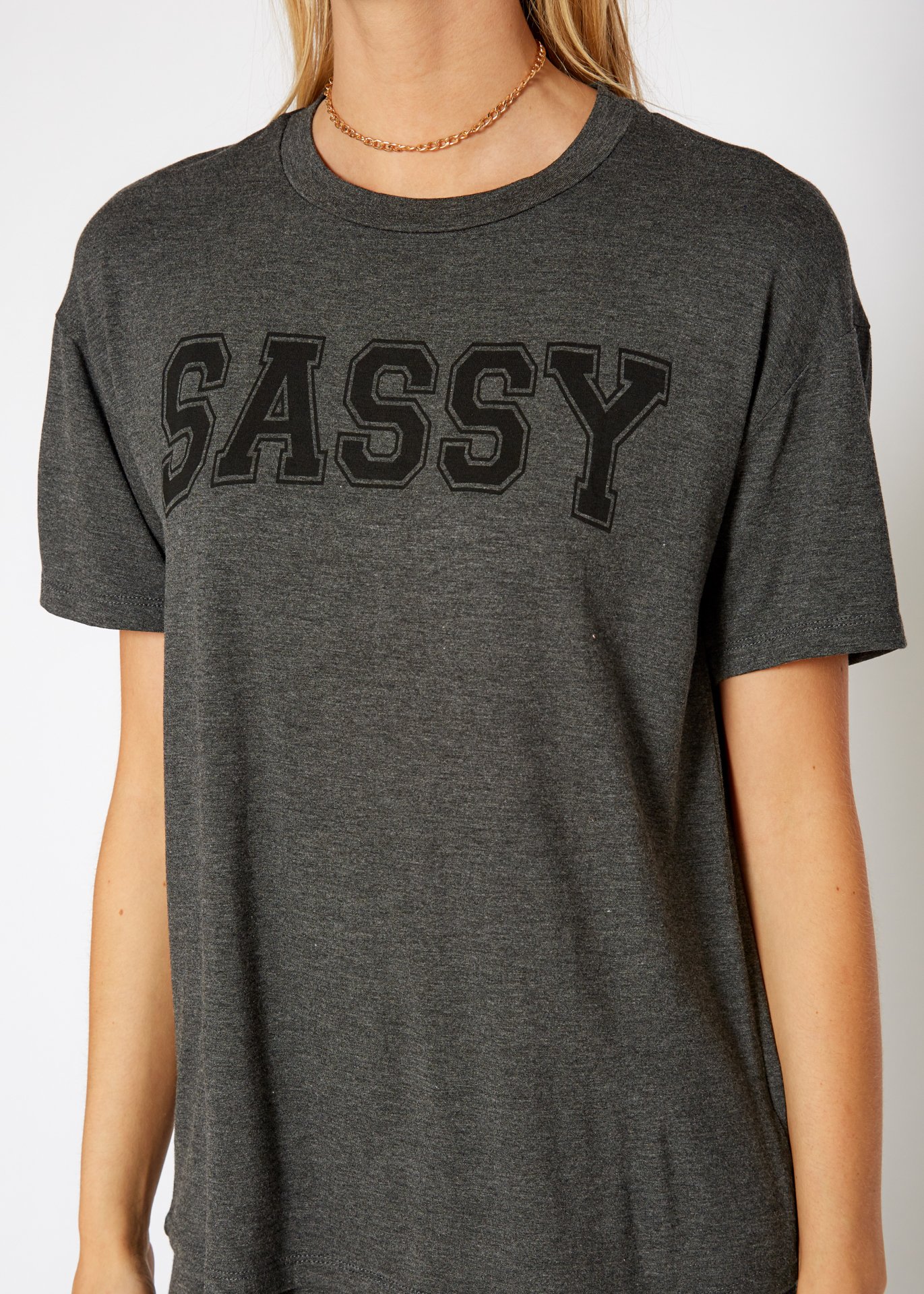 Women's Sassy Basic T-Shirt featuring a round neck, short sleeves, and a boxy fit, made from a soft rayon and spandex blend.