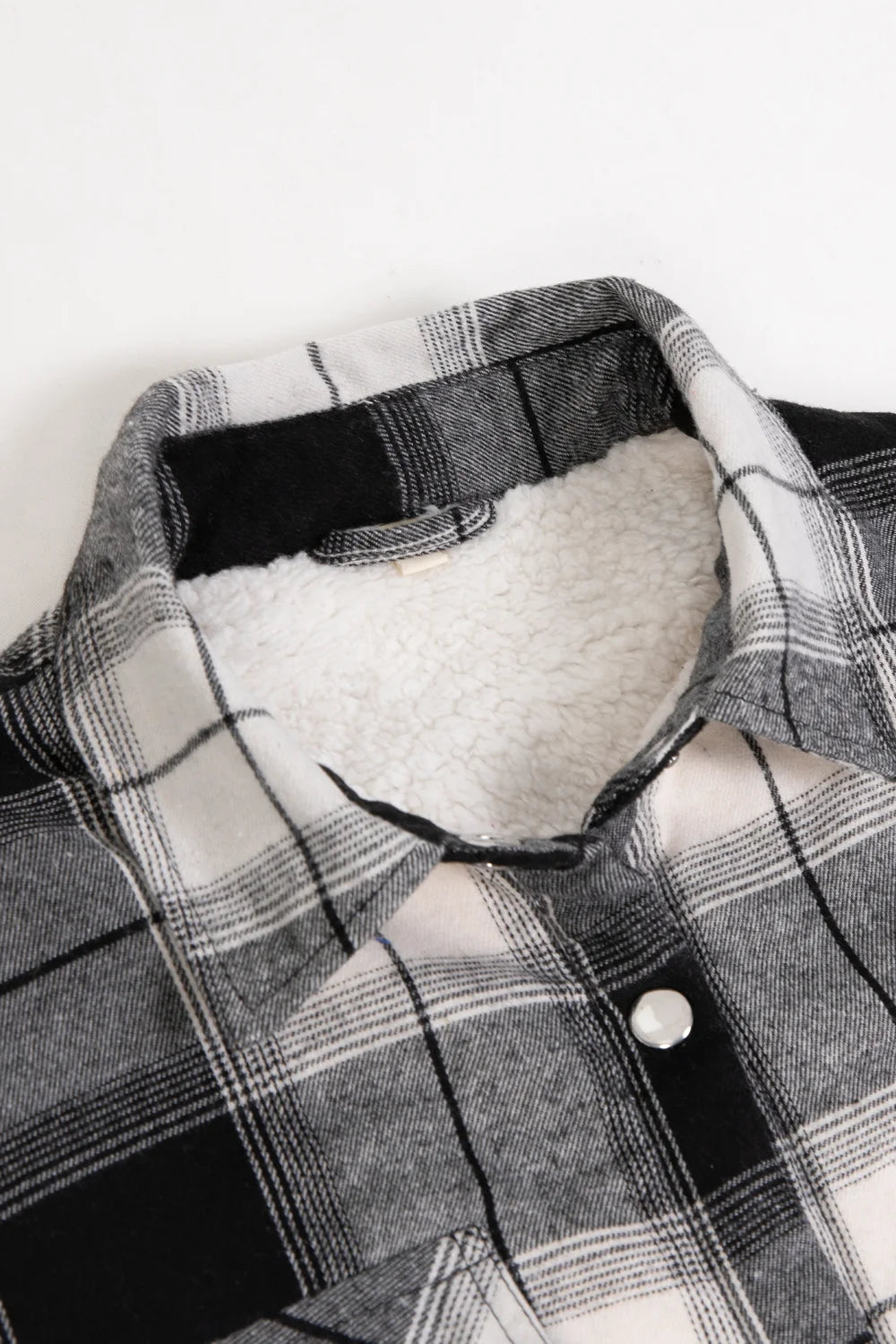 Women's Snap Plaid Flannel Jacket with sherpa lining, featuring a cozy hood and stylish plaid pattern.