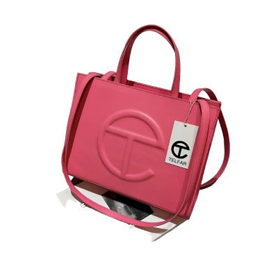 A stylish Women's Spring & Summer Fashion Handbag in a solid color, featuring a small square shape, single shoulder strap, and secure zipper closure.