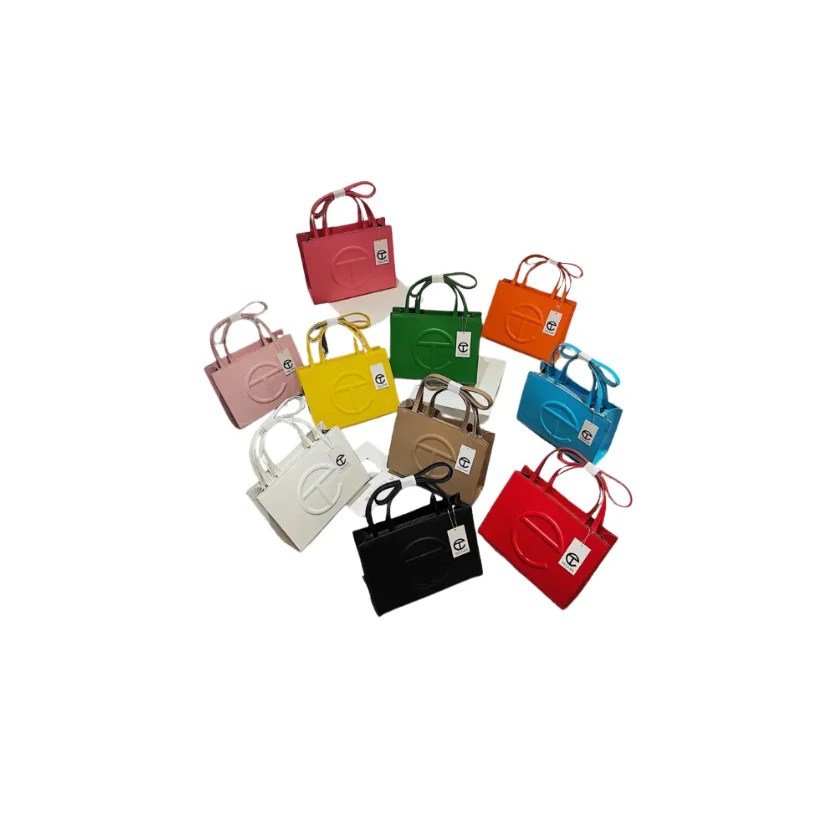 A stylish Women's Spring & Summer Fashion Handbag in a solid color, featuring a small square shape, single shoulder strap, and secure zipper closure.