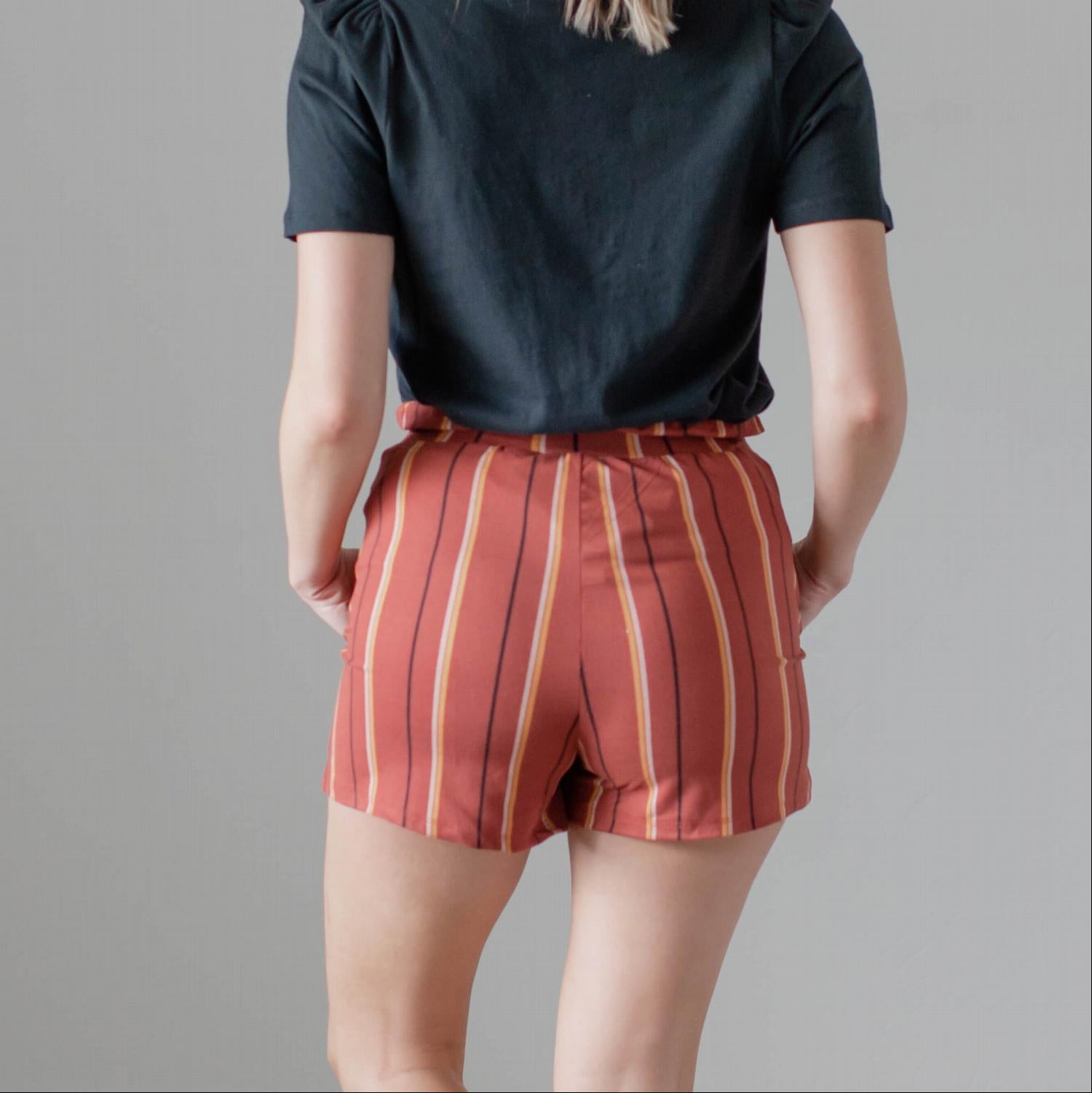 Women's high-waisted striped shorts with a waist tie, featuring a brushed stripe design and front pockets.