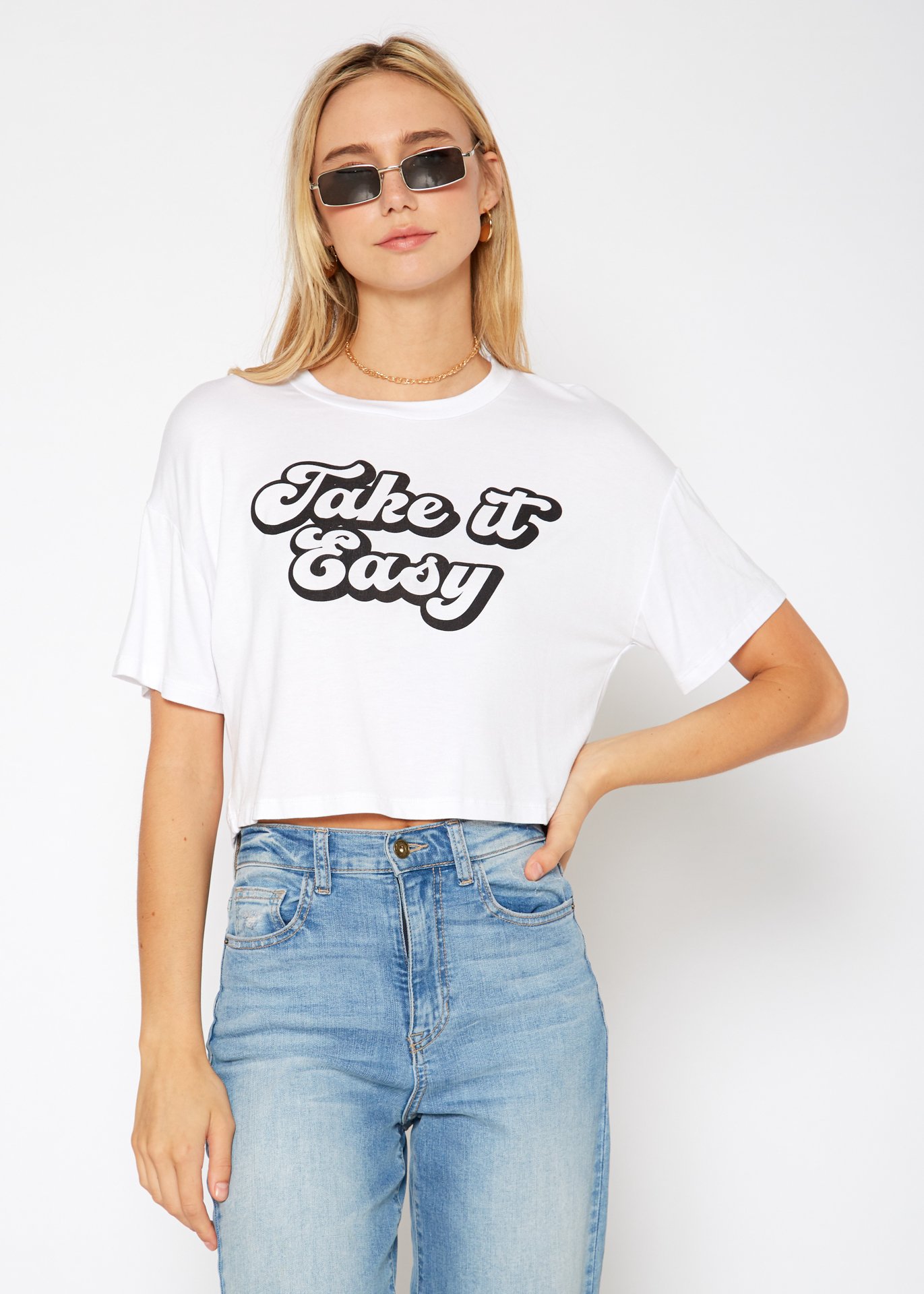 Women's 'Take it Easy' Printed Crop Top featuring a round neck and short sleeves, made from a soft rayon and spandex blend.