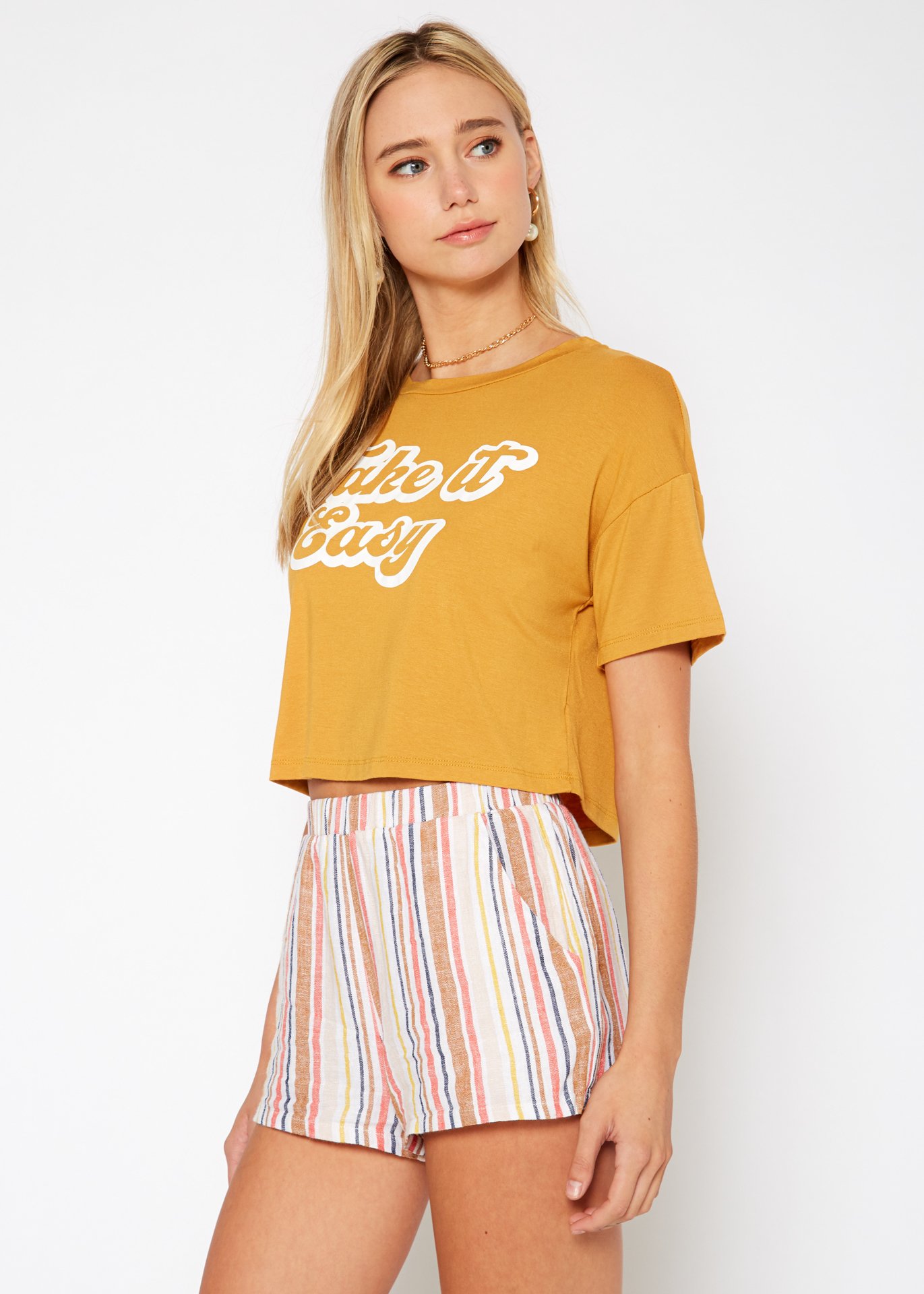 Women's 'Take it Easy' Printed Crop Top featuring a round neck and short sleeves, made from a soft rayon and spandex blend.